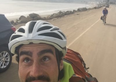 man taking a selfie while riding a bike